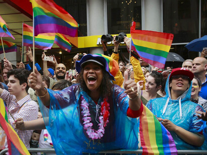 Spectators cheer marchers during the annual Gay Pride Parade in New York City