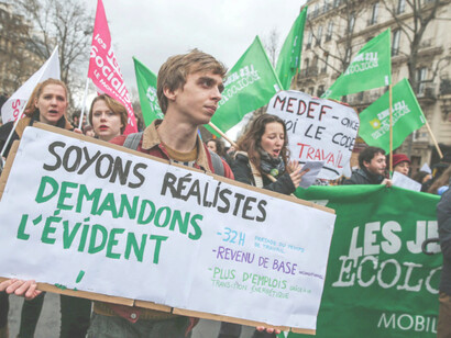 Universal basic income supporters in Paris march in protest against labour reforms