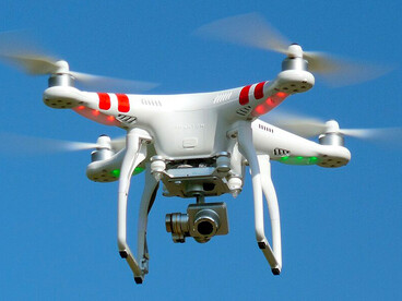 A spying quadcopter drone equipped with a camera