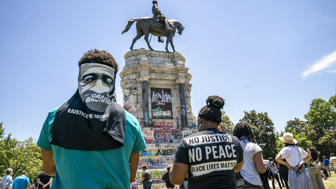 People gather at the Robert E. Lee Monument in Richmond, Virginia