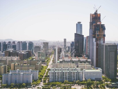 Tower cranes shaping the evolving skyline of Seoul, South Korea, symbolising the country's strategy of investing today for decades of future prosperity