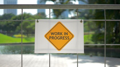 A sign to remind us that humanity's progress is still a work in progress