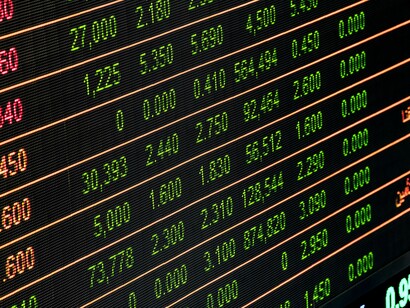 A stock exchange board. The severity and duration of a recession play a crucial role in determining its impact