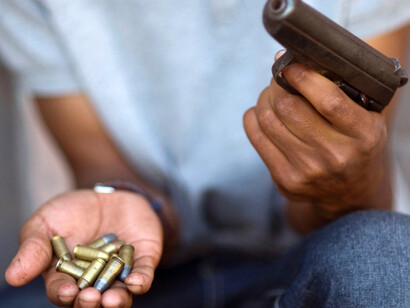 Man with gun and bullets