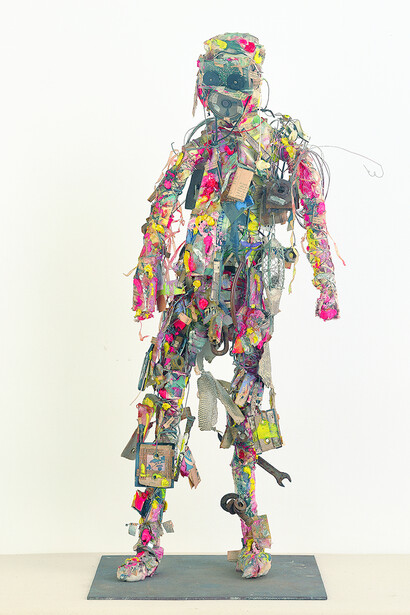Shinro Ohtake, Radio Head Surfer, 1994-95, oil, oil paint, spray paint, photograph, cotton cloth, photographic film, printed matter, aluminum film, wire, cotton, plastic, iron, wood, snakeskin, thin paper, staple, plug, transistor radio, hemp cloth, vinyl, distribution cable, plastic sheet, earphone, nib, nylon thread, dry battery, iron plate, 82.6 x 33.4 x 18.6 cm, Courtesy of the artist and Take Ninagawa, Tokyo