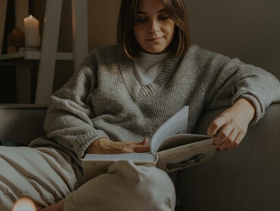 A mother reading a novel art night in the modern age