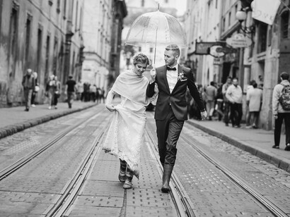 Old-world charm and a little rain bring timeless romance to life in this wedding moment