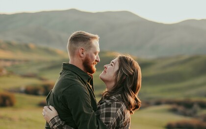 A couple embracing while gazing into each other’s eyes
