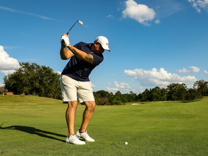 A golfer ready for a powerful drive, symbolizing the timeless appeal of French Lick's celebrated golf tradition