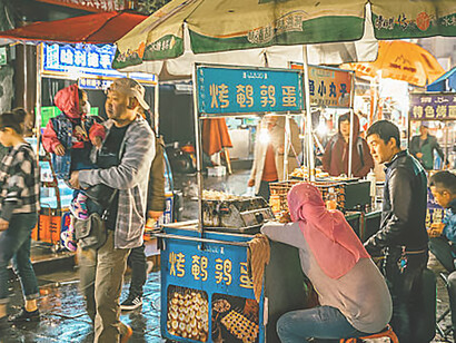 Explore the bustling Muslim street market in Xi'an, China, renowned for its vibrant atmosphere and diverse culinary delights, offering a sensory feast for visitors