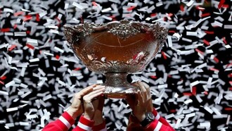 Stanford University title in tennis being hoisted by the entire team