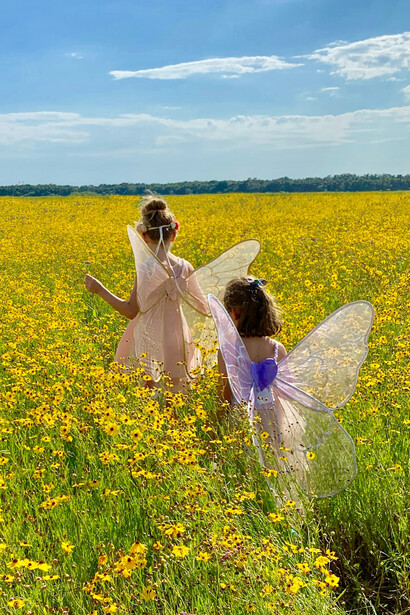 Children running through the fields, symbolizing innocence