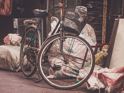 This quiet moment captures the essence of urban life in China, where bicycles symbolise both individual freedom and a commitment to sustainable living