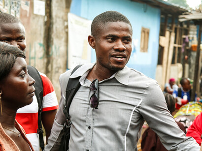 Conversations among community members of a low-income area highlight a pressing issue, despite global wealth being ample, resources aren't equitably distributed, leaving many in poverty while others accumulate vast fortunes