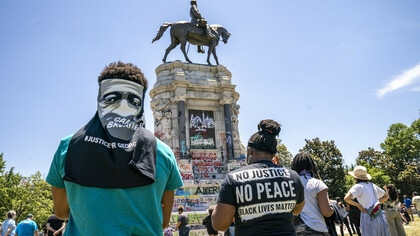 People gather at the Robert E. Lee Monument in Richmond, Virginia