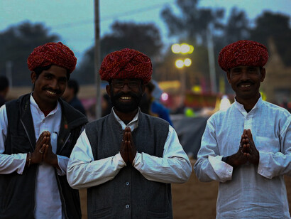 Some Indian men in the streets. From North to South and East to West, dal has the whole population of India wrapped around its husks