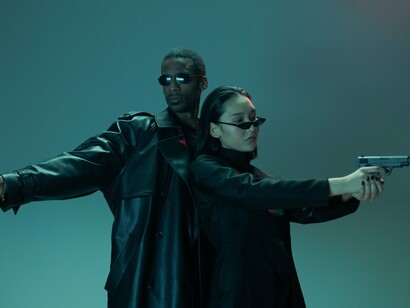 A modern recreation of The Matrix's signature action pose, reflecting the franchise's lasting impact on science fiction and popular culture