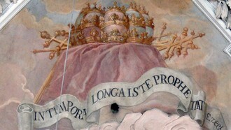 Emblema de San Malaquías con una cita del libro de Ezequiel: “IN TEMPORA LONGA ISTE PROPHETA” [Este profeta para la eternidad]. Metten (Baja Baviera). Iglesia de la abadía: fresco (1722/24) de Wolfgang Andreas Heindl