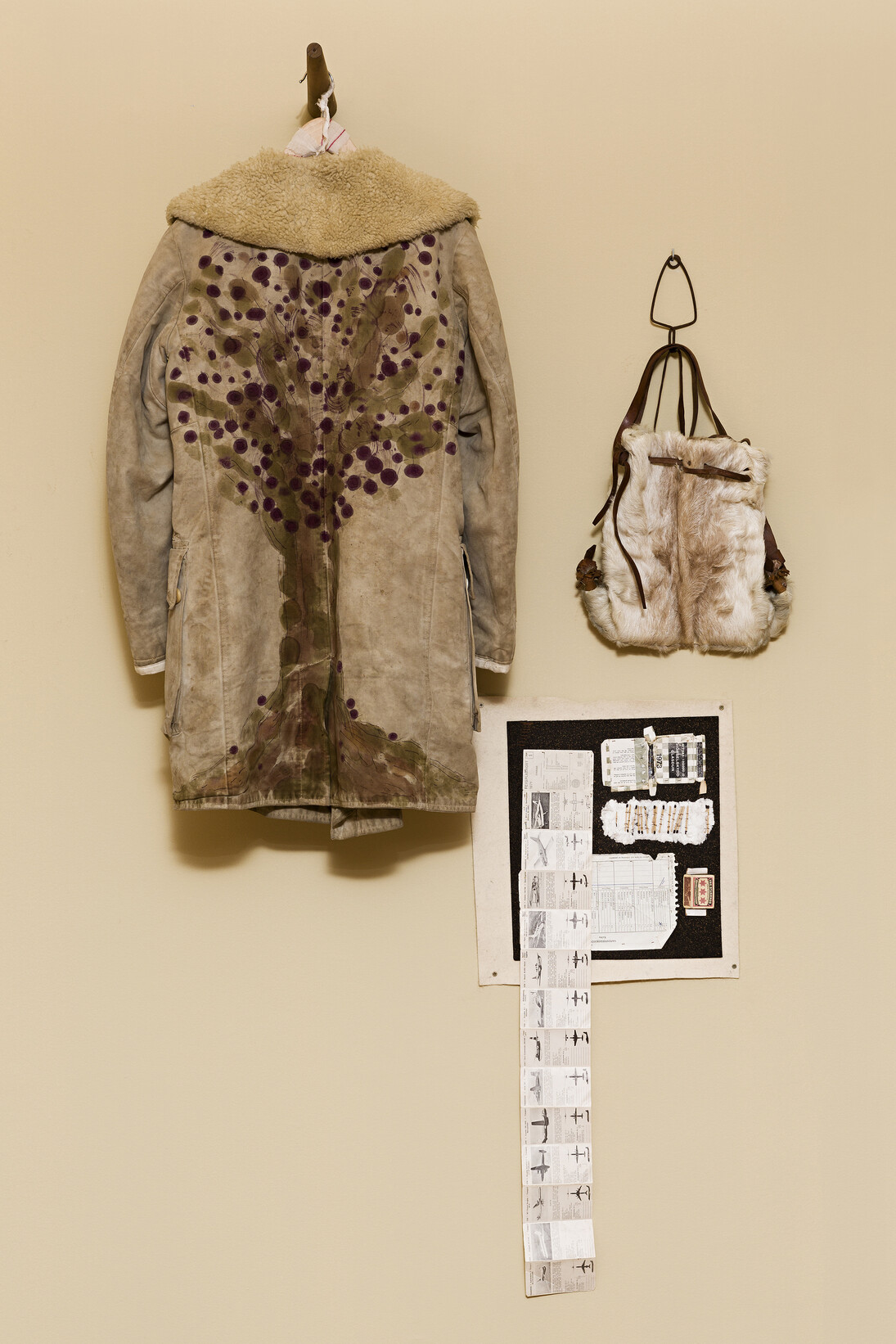 f.marquespenteado, Enraizar Jonas, 2011/2014, canvas coat with wool lining, leather shoes aniline, wood hanger, backpack, and collage on cork and felt, found objects stitched by hand, Edition: N/A, 193 x 105 x 30 cm. Courtesy of Mendes Wood DM, São Paulo