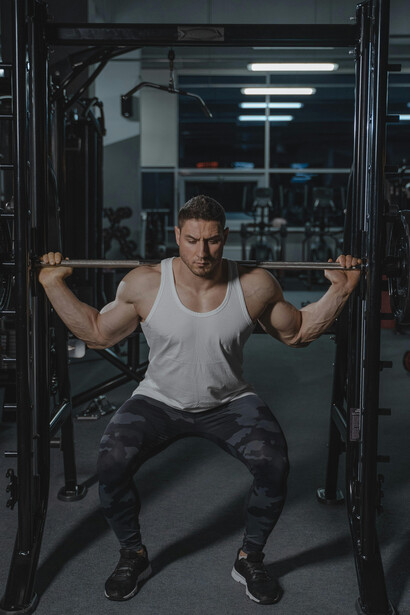 A focused athlete lifting a heavy barbell during an intense gym workout