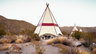 Ryann Ford. Near Lajitas, Texas – FM 170 – This is one of the most remote rest areas in the country. These teepees are hidden just outside Big Bend National Park, right on the Rio Grande, which divides the United States and Mexico. As we were shooting, a pack of Javelinas ran by.
