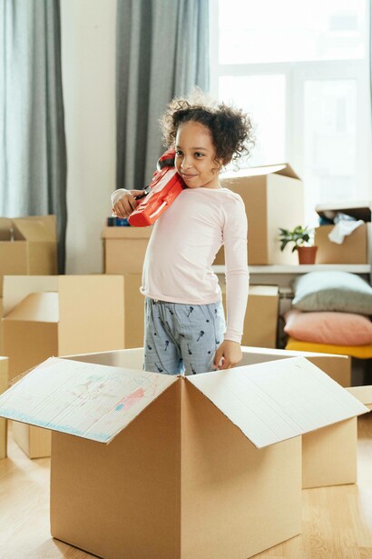 Young girl stands tall with her water gun