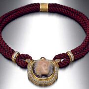Necklace in gold with silk cord, sardonyx cameo, ruby, and diamonds, c. 1984. Courtesy of Cleveland Museum of Art