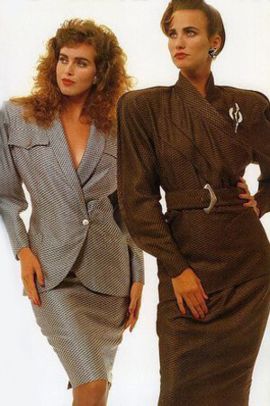 Professional woman wearing a brown-toned power suit with skirt, embodying 1980s corporate style and confidence