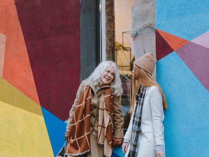 Grandma talking with her granddaughter on an outing