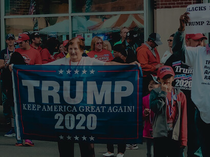 Activists converge near building, waving banner for US elections awareness