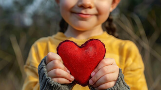 Hands forming a heart, symbolizing peace, love, and the universal bond of humanity