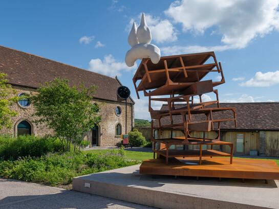 Phyllida Barlow, untitled: stackedchairs (detail), 2014, timber, plywood, cement, paint, sand, PVA, varnish, 150 x 640 x 455 cm / 59 x 252 x 179 1/8 inches, © Phyllida Barlow Estate. Courtesy of the Phyllida Barlow Estate and Hauser & Wirth. Photo: Alex Delfanne
