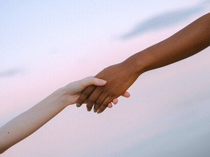 Hands reach out to each other for help