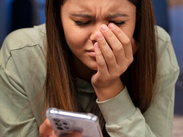 A teenage girl struggling with social media pressures
