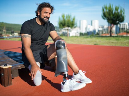 A man getting ready for physical activity outdoors, symbolizing the idea of starting small when creating positive change