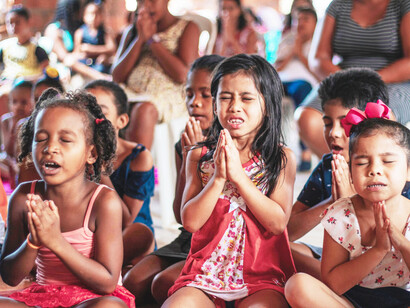 Three little girls from São Luís, Maranhão, Brazil, praying
