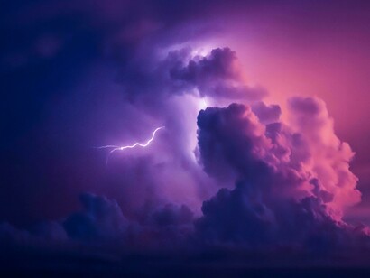 Lightning starts to form amongst clouds, representing the impending storm that could end up causing major destruction