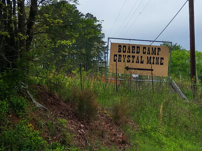Sign near the road showing where Board Camp Crystal Mine is, in Arkansas, USA