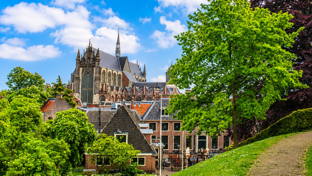 Scenic view of the historic Hooglandse Kerk and the surrounding traditional buildings along the canals of Leiden, Netherlands