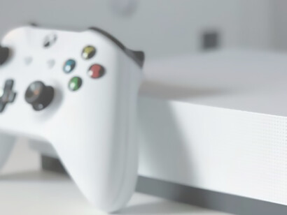White xbox one console on white table