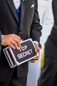 Man holding a top secret sign