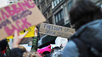 Women's March in New York, a banner says: Freedom of Speech Includes The Press, USA