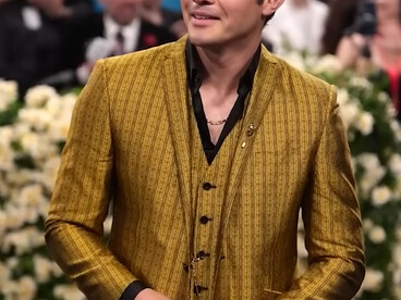 Henry Golding in Ozwald Boateng, wearing a gold three-piece tailored suit inspired by Black dandyism during the 2025 Met Gala