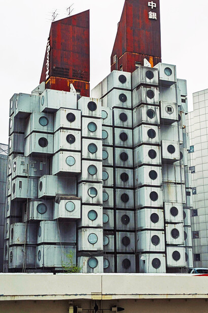 Exterior view of the Nakagin Capsule Tower, a modular capsule apartment building in Tokyo, Japan