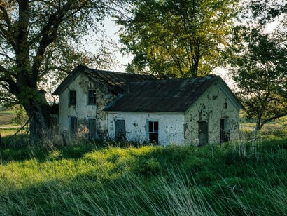 An old family home preserved by memory rather than renovation, reflecting the weight of inherited traditions
