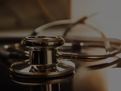In the foreground, a medical instrument on paperwork visually underscores the crucial connection between precise documentation and essential healthcare tools