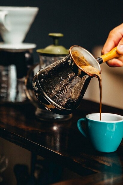 Espresso shot being poured into a cup