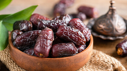 Enhance your culinary creations with a captivating display of Mejhool dates in a bowl