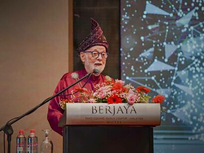 Jeffrey Levett speaking, Sura Al-Mulk from the Holy Qur'an and a graduate and family with JL holding hand of its youngest member