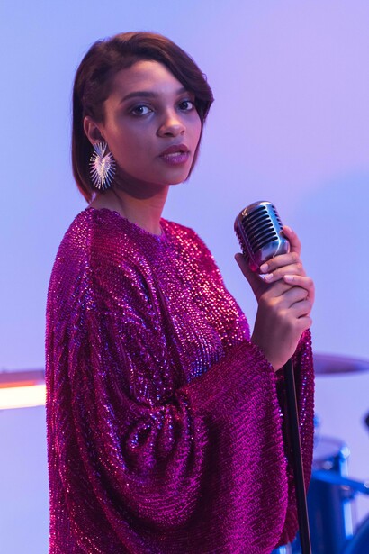 Woman staring into the abyss with microphone